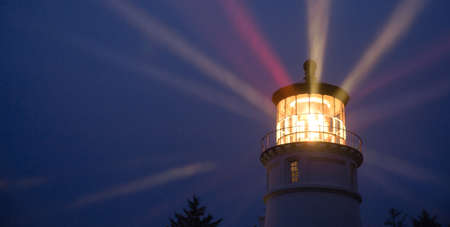 A perfect storm is just the right weather to make a lighthouse earn its keep for weary travelersの写真素材