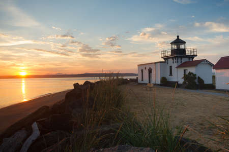 Waves hit the beach in the early morning on Puget Soundの写真素材