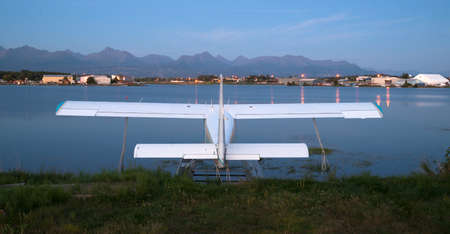 A plane sits waiting for the next chance to be of service as darkness falls on Anchorageの写真素材