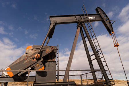 Wyoming Industrial Oil Pump Jack Fracking Crude Extraction Machineの写真素材