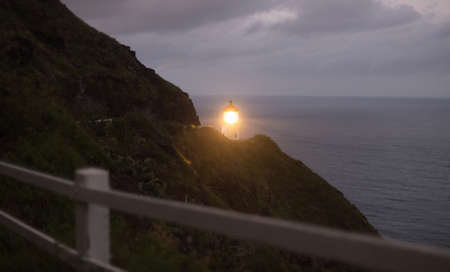 This lighthouse sends a beam of light out to the Pacific Ocean for miles awayの写真素材