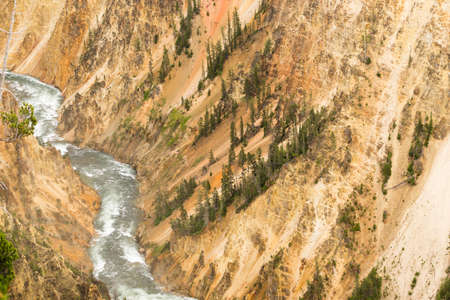 A wild Yellowstone River cuts through a vast canyonの写真素材