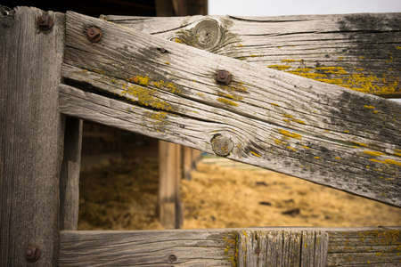Close up of a weathered wood farm gateの写真素材