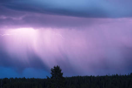A storm passes thru quickly over Norris Canyon Road in Yellowstoneの写真素材