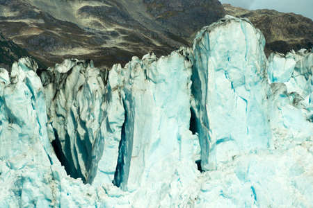 Glacier ice takes on a blue color in the sunshine