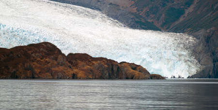 Glacier ice takes on a blue color unless glacial debris covers itの写真素材