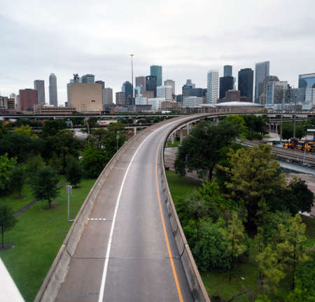 A ramp leading out of downtown Houston with no cars on itの写真素材