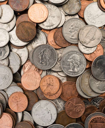 A selection of coins laid out for countingの写真素材