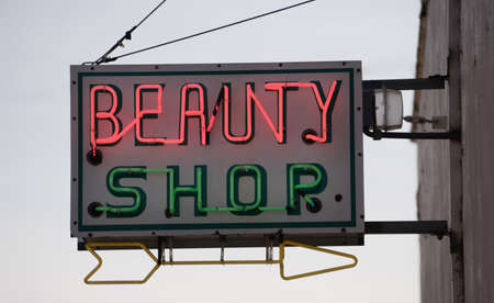 The beauty palor is closed but the neon sign is onの写真素材