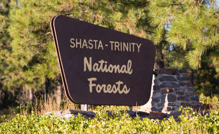 A monument sign marks the boundary of public National Forest land in Californiaの写真素材