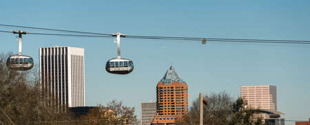Cars mounted to cables move people from the river waterfront up to the Marquam Hill Neighborhoodの写真素材