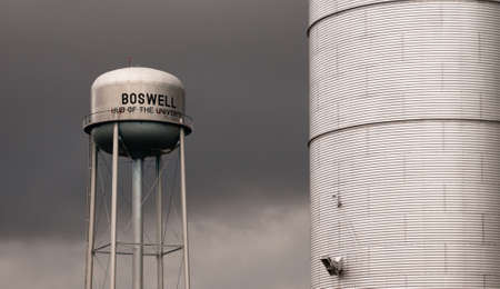 Storm rolls over the town utility and agriculture infrastructure in the midwest at Boswell Indianaの写真素材
