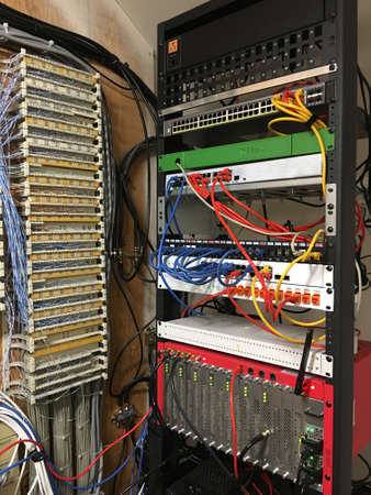 A view a buidling communication room with satelite tv, phone switchboard and internet serversの写真素材