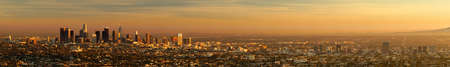 An expansive view of the area around the city skyline of Los Angeles Califonia at sunsetの写真素材