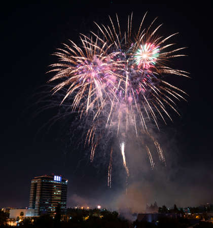 People gather to watch the fireworks in Discovery Meadow Park in San Jose Californiaの写真素材