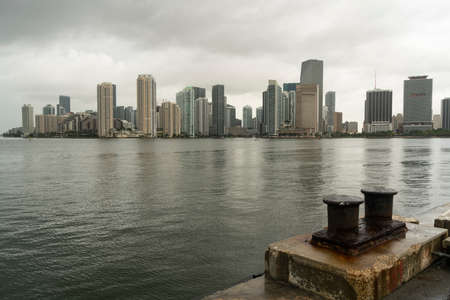 A rusty ship tie down weathers the rain during Hurricane Season in Miami Floridaの写真素材