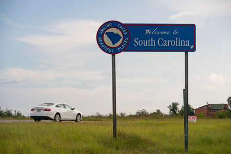 Horizontaal composition car moves on highway entering South Carolina from Georgiaの写真素材