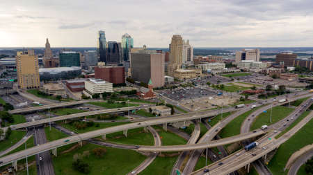 Cars and trucks move in and out of The Downtown City Center of Kansas City Missouriのeditorial素材