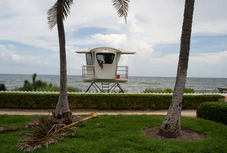 A towel hangs over the window of an elevated coast life guard hut shack Palm Beach Floridaのeditorial素材