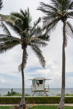 A towel hangs over the window of an elevated coast life guard hut shack Palm Beach Floridaのeditorial素材