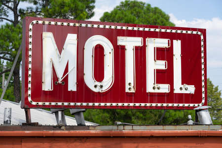 A vintage red motel sign of an old building in Texarcana, USAの写真素材