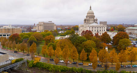 Its an overcast day but the aerial view shows color in the Autumn leaves in Providence RIの写真素材