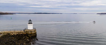 A beacon in Portland harbor warns mariners of dangerous rocks and surf on the Atlantic Ocean East Coastの写真素材
