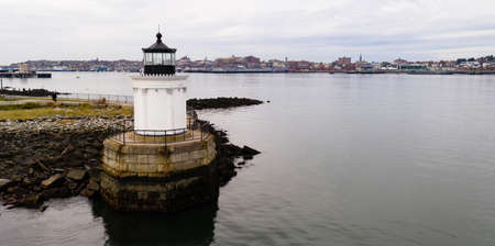 A beacon in Portland harbor warns mariners of dangerous rocks and surf on the Atlantic Ocean East Coastの写真素材