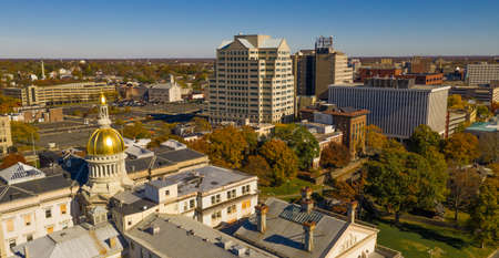 The state capital dome reflects sunlight late afternoon in downtown Trenton New Jerseyの写真素材