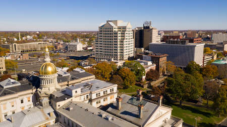 The state capital dome reflects sunlight late afternoon in downtown Trenton New Jerseyの写真素材