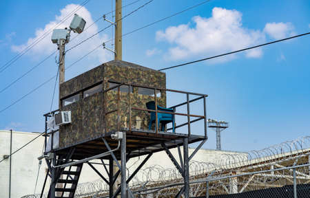 Not so Camo hut suspended on a metal frame gives guards a vantage point to watch inmatesの写真素材