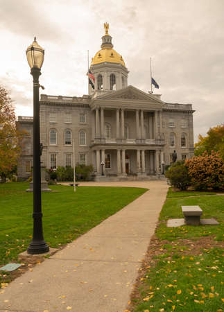 Fall leaves on the lawn at the State Capital Building of New Hampshire at Concordの写真素材