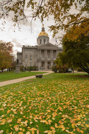 Fall leaves on the lawn at the State Capital Building of New Hampshire at Concordの写真素材