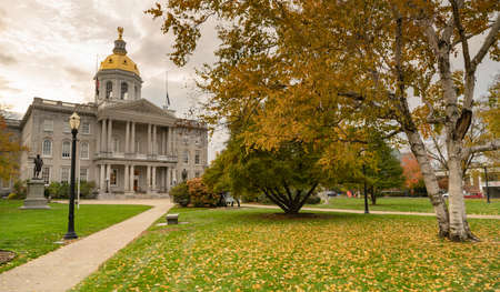 Fall leaves on the lawn at the State Capital Building of New Hampshire at Concordの写真素材