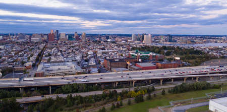 The buildings are illuminated in the downtown urban core of Baltimore Marylandの写真素材