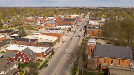 Traffic moves around downtown on Main Street in Indiana at North Rochesterの写真素材