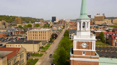 Aerial Elevating Up Over Chruch Clocktower and Charleston West Virginiaの写真素材