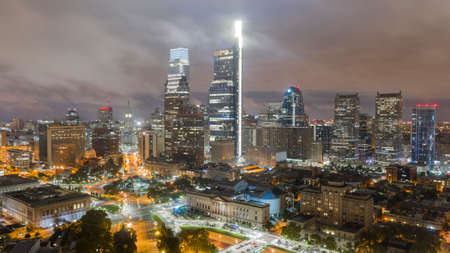 Fog passes building tops around the high elevations in downtown Philadelphia PAの写真素材