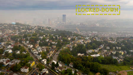 A thick layer of fog still has not burned off over downtown Pittsburgh and suburbsの写真素材