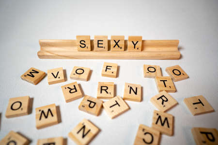 White background letter pieces spell out the word Sexyの写真素材
