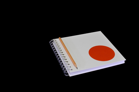 Isolated of white notebook with pencilの写真素材