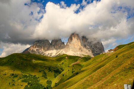 Photograph of the peaks of a cloud-covered mountains