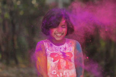 Young Girl Covered in Pink Powder