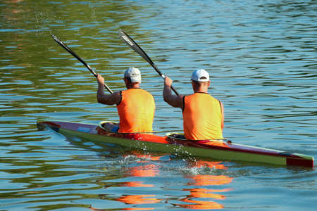 Young men rowing in a kayak