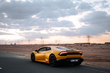 Yellow Sports Car on Road