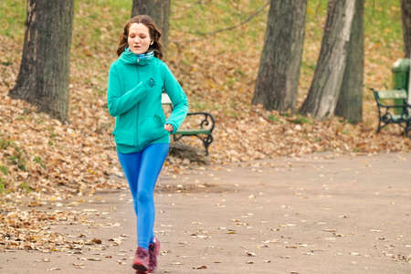 Young woman running in park
