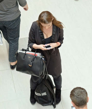 Young woman watching phone