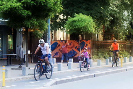 People walking on bikes in the city
