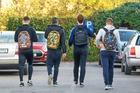 Four boys with backpacks