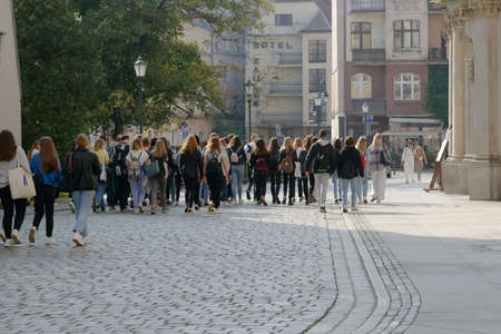 Group of young tourists visiting the city